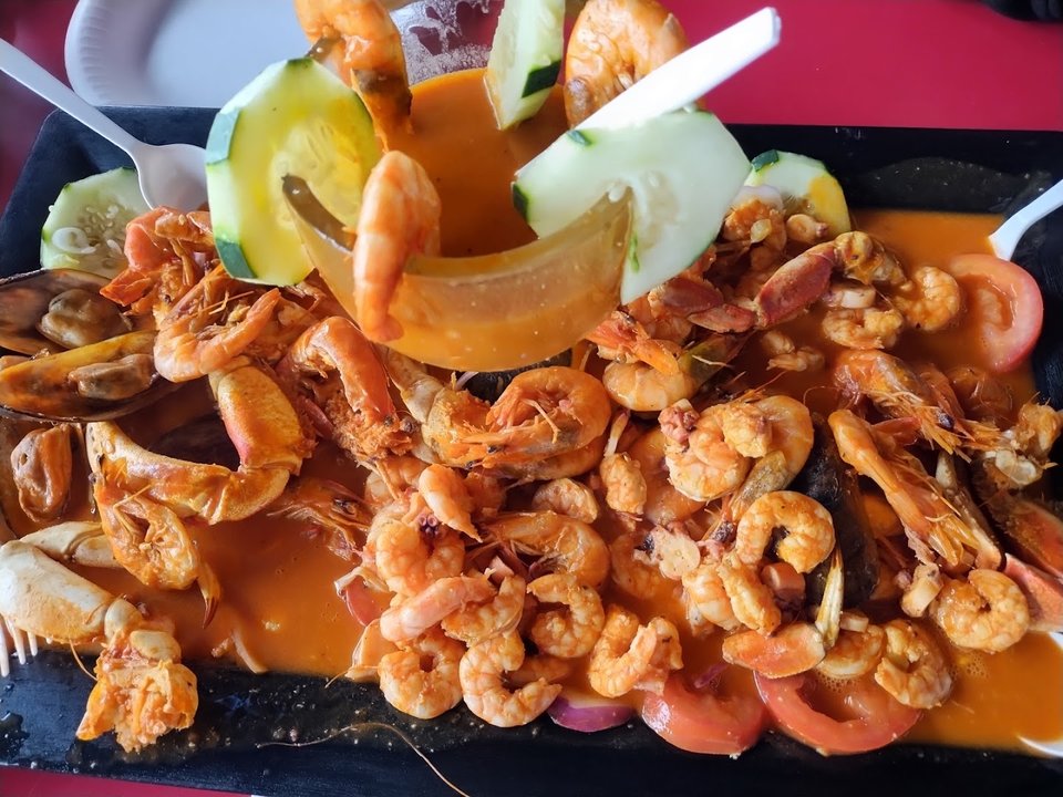 Seafood plates on a casual restaurant table.